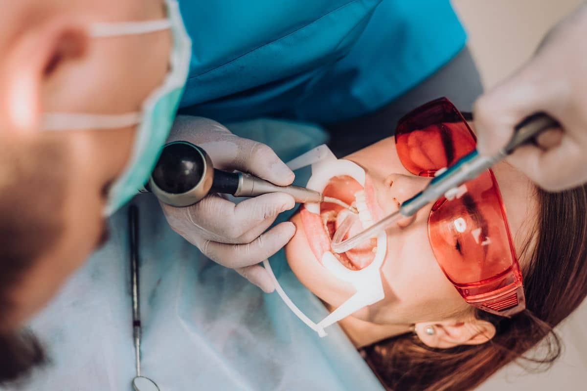 Laser gum treatment performed by a dental professional using laser technology for periodontal care.